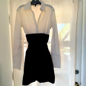 Knee-length black and white dress with French cuffs (and pockets!).